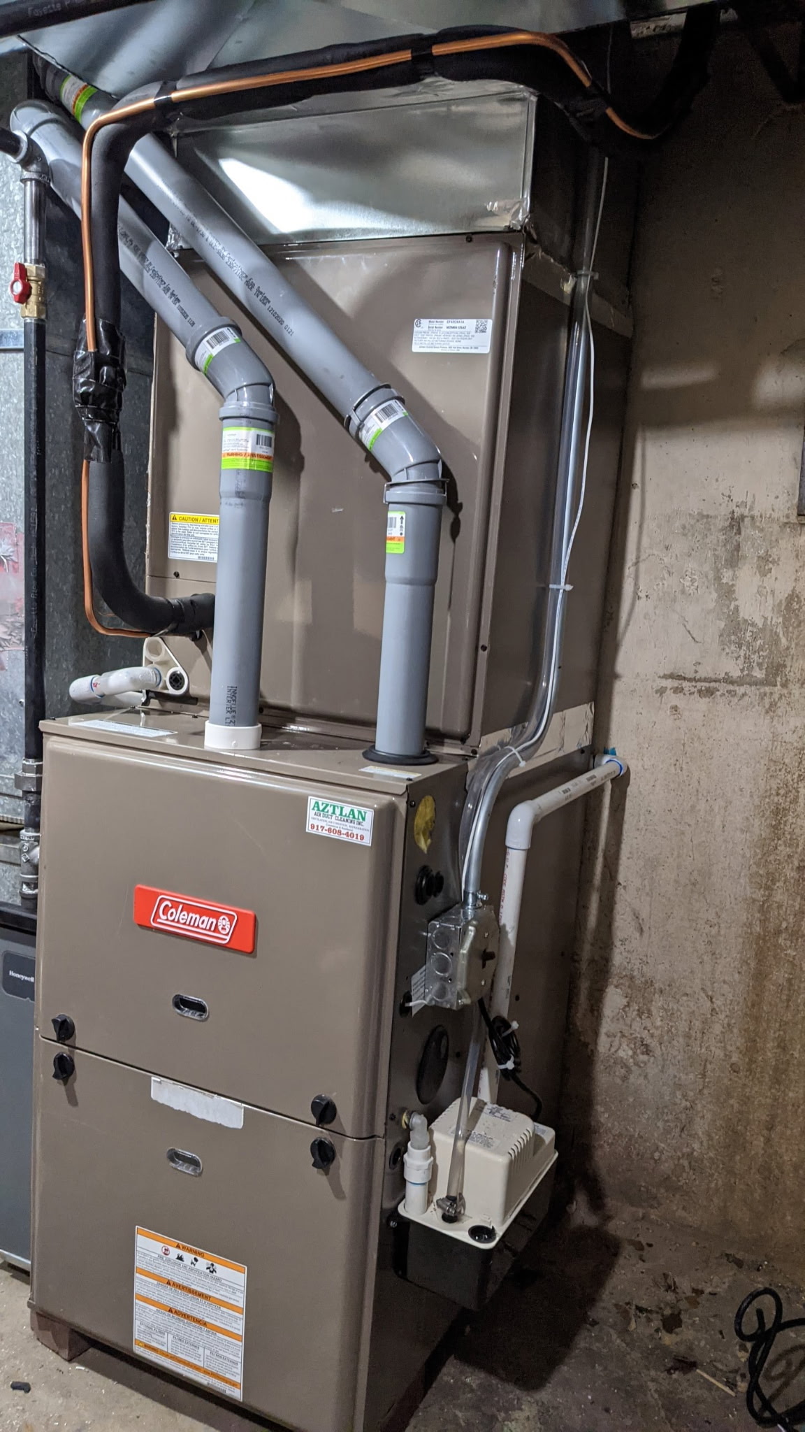 Aztlan technician performing HVAC work